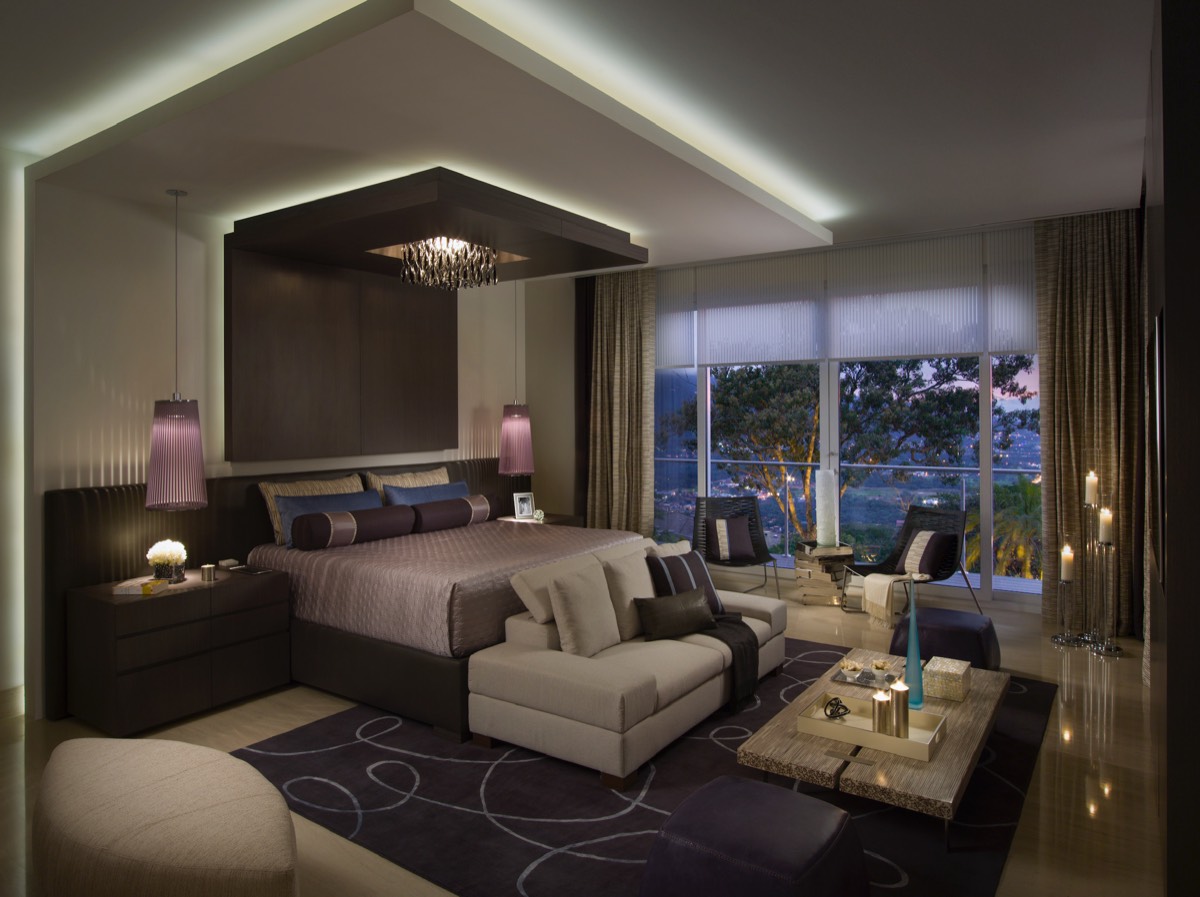 Primary bedroom at dusk with cove lighting